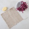 Lingette nettoyante en ortie tricotée pour la douche avec un savon