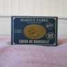 Emballage en carton bleu du savon Marius Fabre ovale